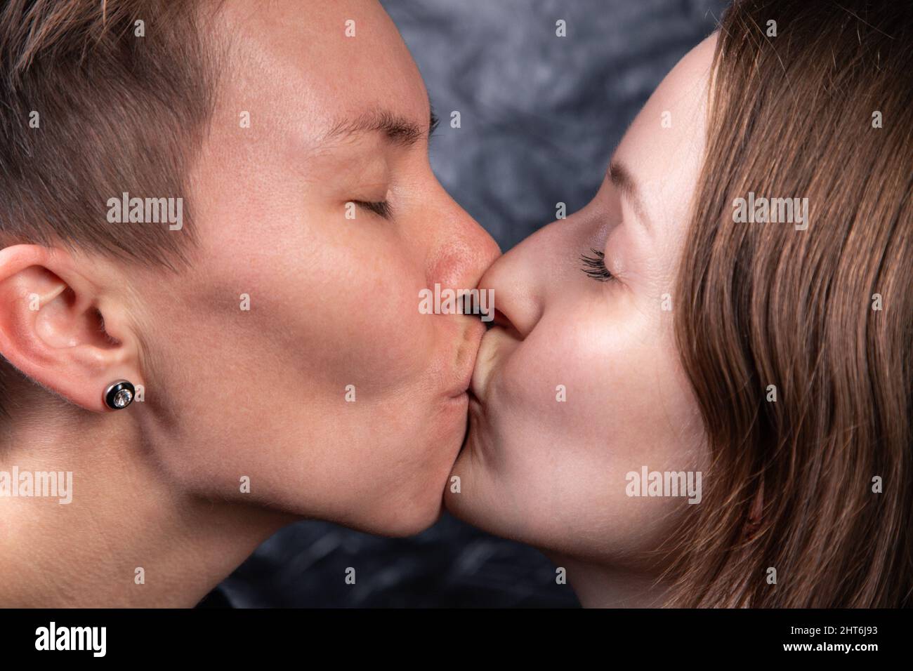 Photo of two kissing homosexual women, close-up Stock Photo