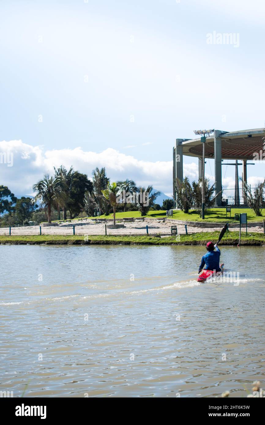 Man riding on a canoe boat Stock Photo - Alamy