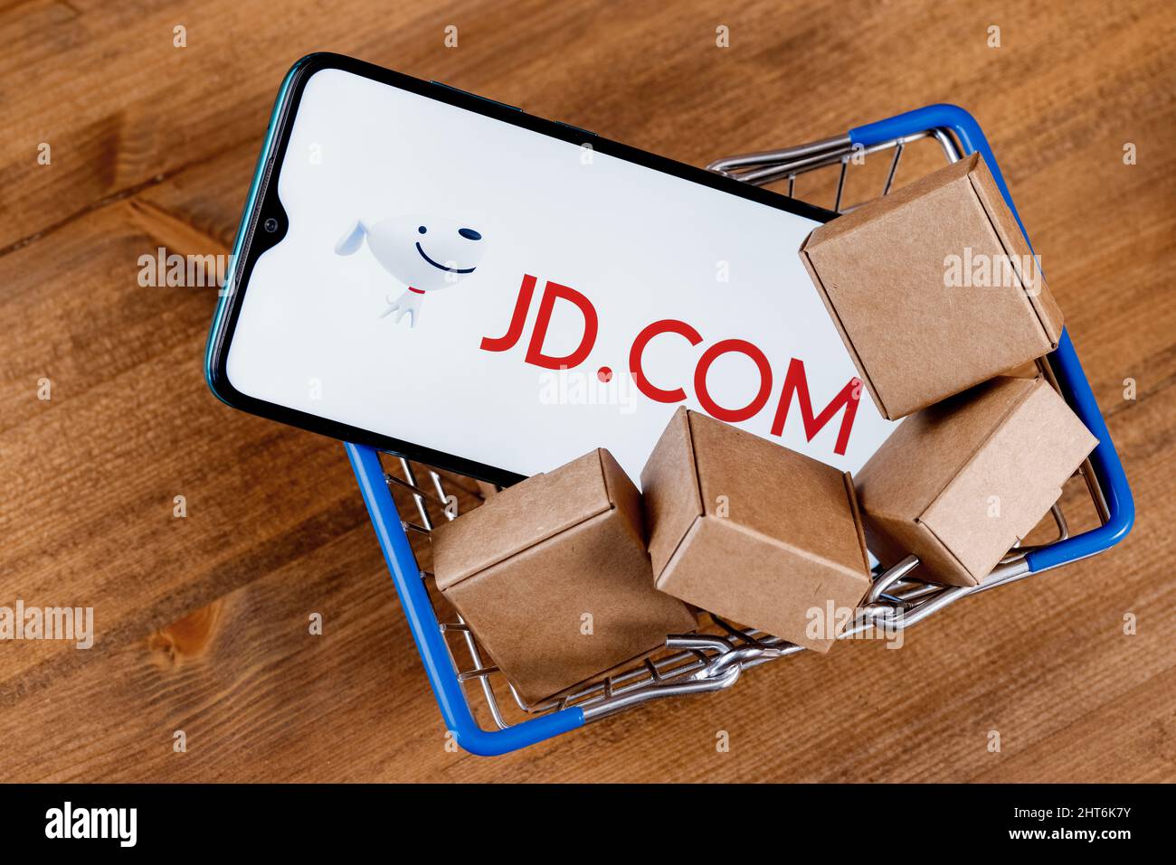 Shopee is e-commerce technology company. Smartphone with Shopee logo on the  screen, shopping cart and parcels Stock Photo - Alamy