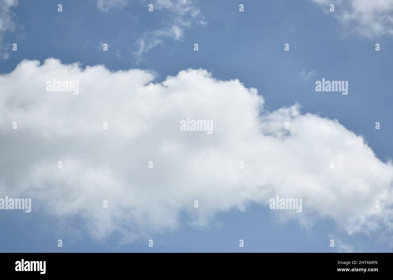 cloud spreading on bright sky in sunny day Stock Photo