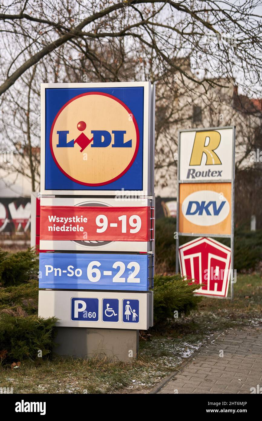 Closeup of a Lidl supermarket board showing opening times and parking