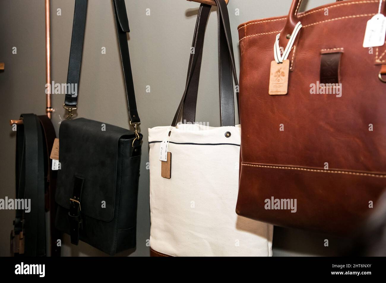 Closeup of bags on display at exhibitor stand at handmade design fair