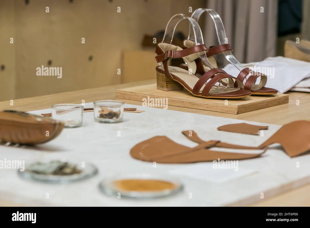 Leather items on display at exhibitor stand at handmade design fair in