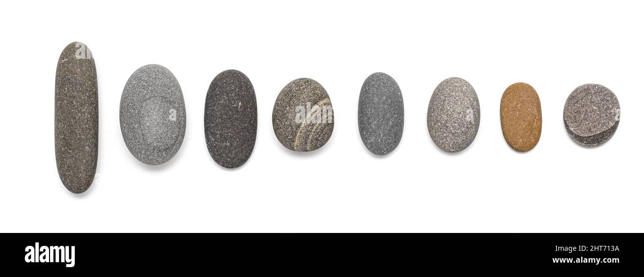 Collection of stones. Various types of pebbles with a soft shadow on a white background. Stock Photo