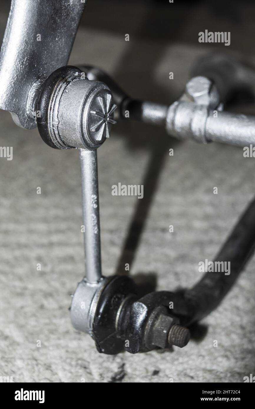 Closeup of a car stabilizer link mounted on rear suspension Stock Photo