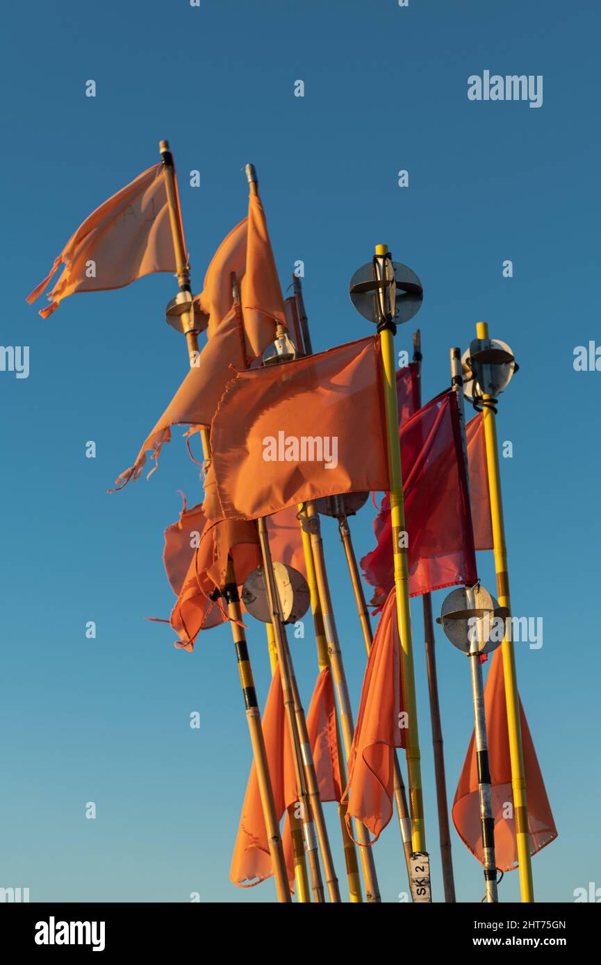 Vertical shot of flags on a fisher boat Stock Photo