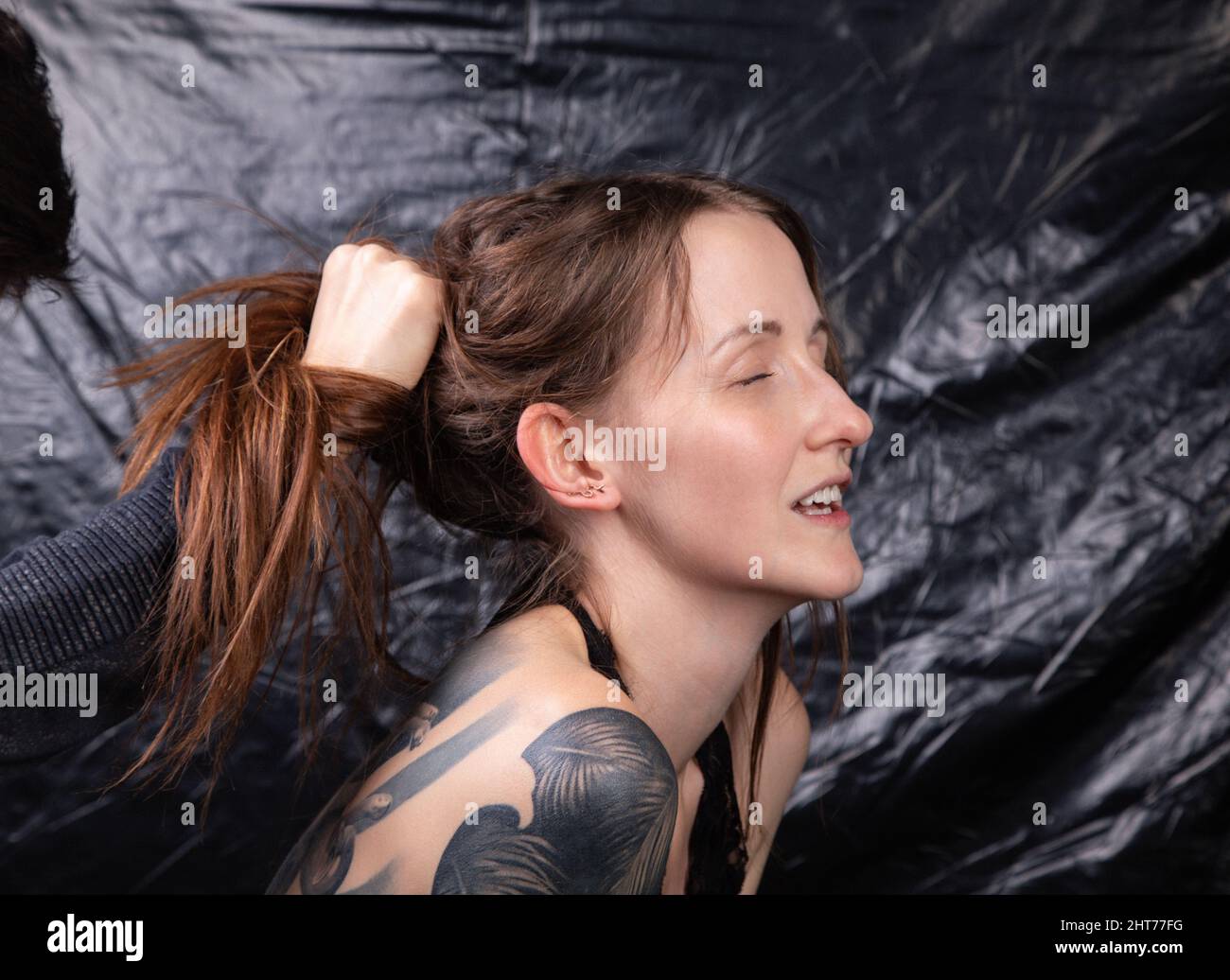 Photo of sexual woman with closed eyes and open mouth Stock Photo