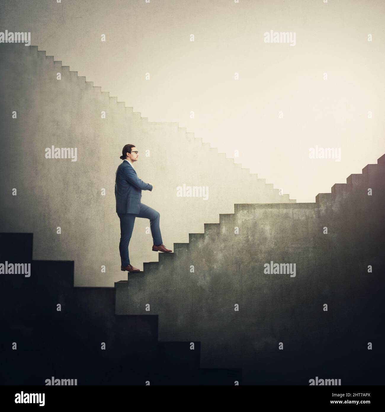 Confident businessman climbing an endless staircase with ups and downs, determined to reach the end and achieve success. Infinite stairway as business Stock Photo