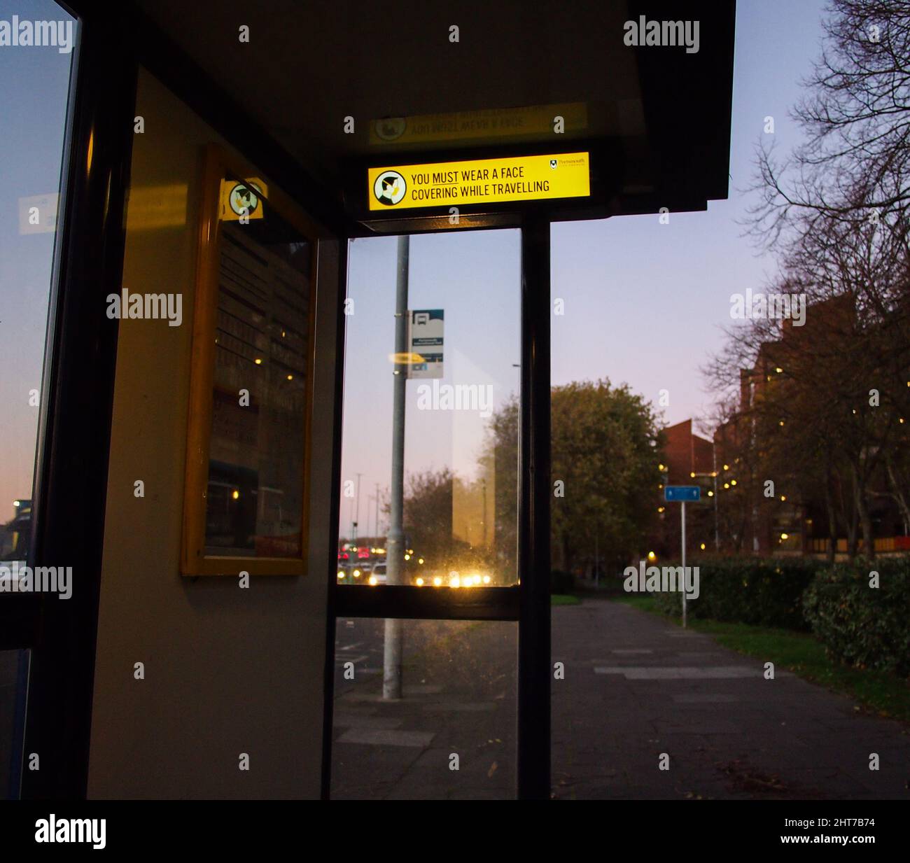 A bus stop shelter with electronic sign in England Stock Photo
