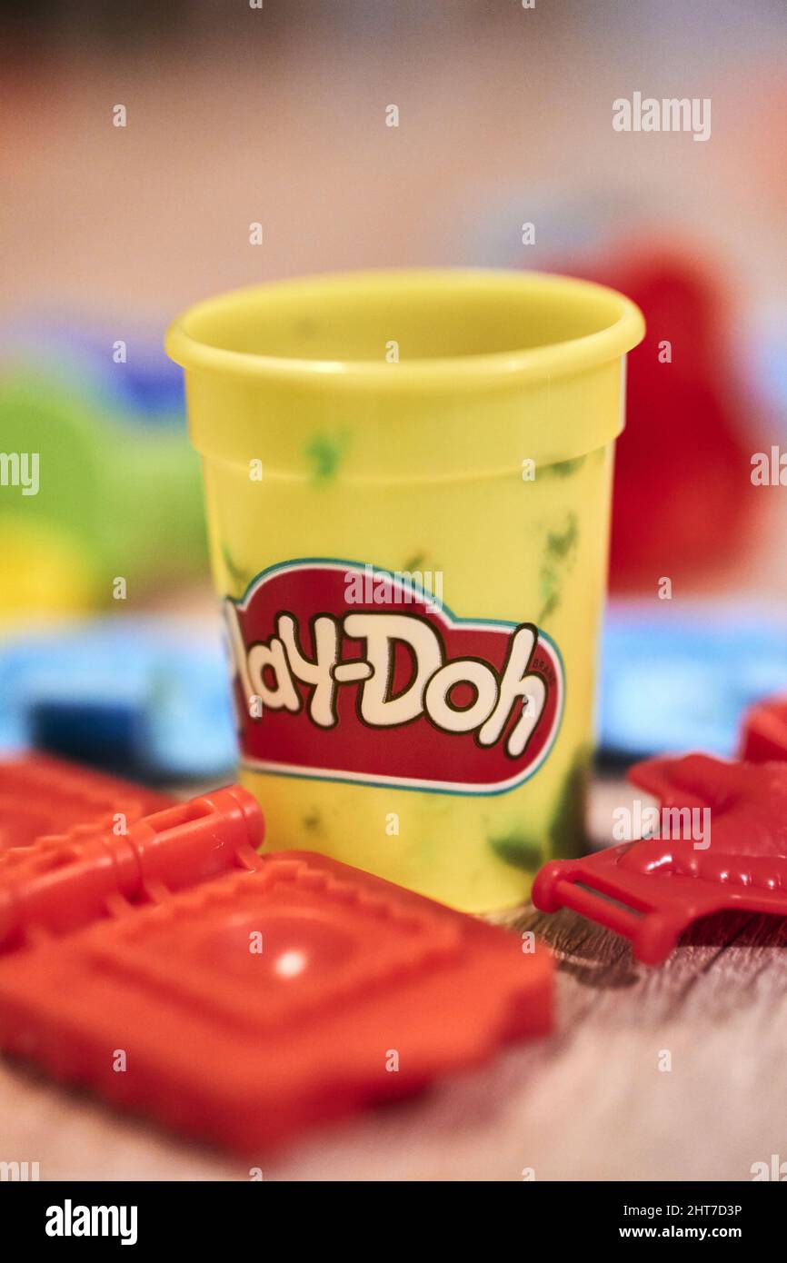 An opened plastic Play Doh container on a table Stock Photo - Alamy