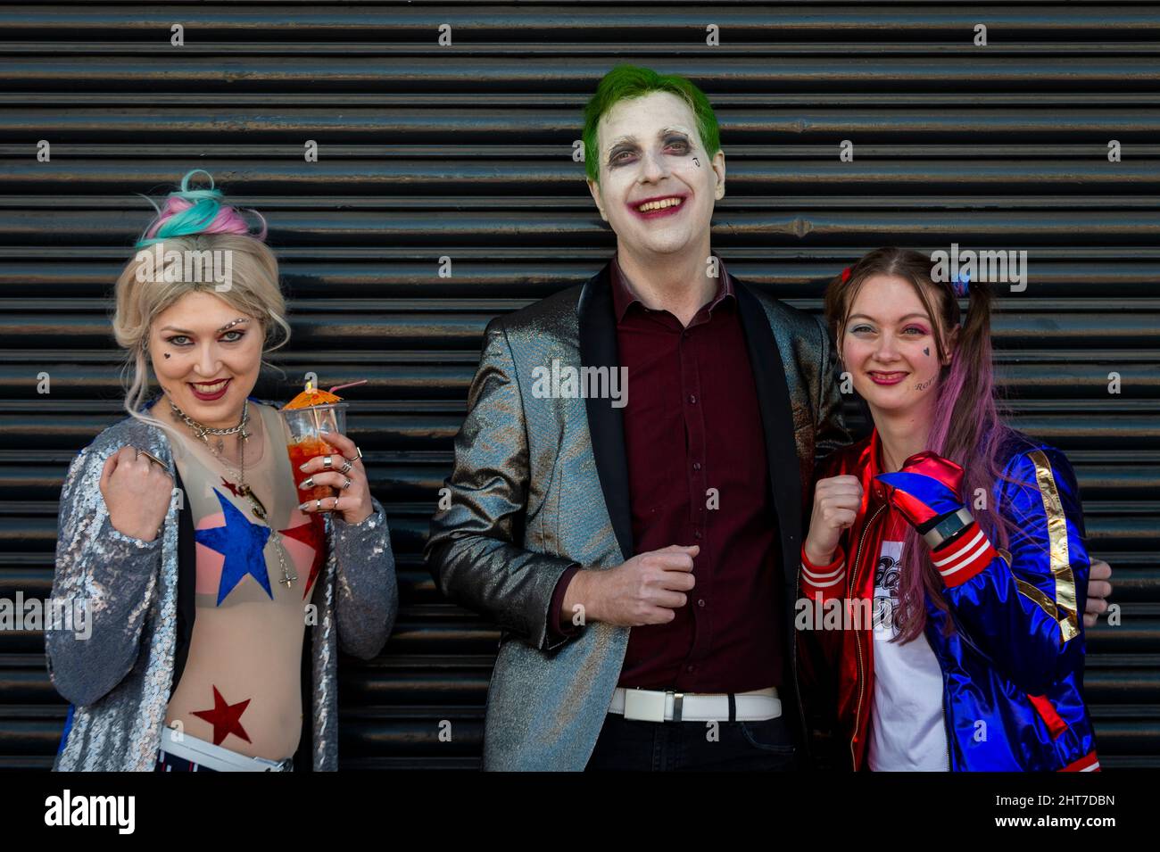 London, UK.  27 February 2022.  People dressed Harley Quinn and The Joker, DC comics characters, arrive at London Comic Con Spring held in Kensington Olympia.  The festival celebrates comics, film and TV.  Credit: Stephen Chung / Alamy Live News Stock Photo