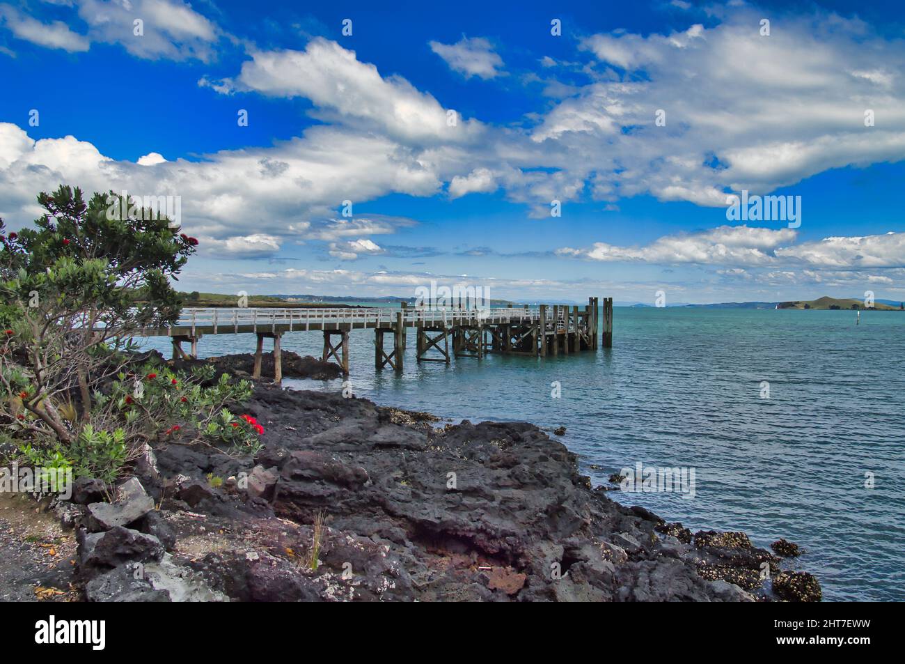 The pier of the ferry to Auckland on Rangitoto Island in Auckland Bay ...