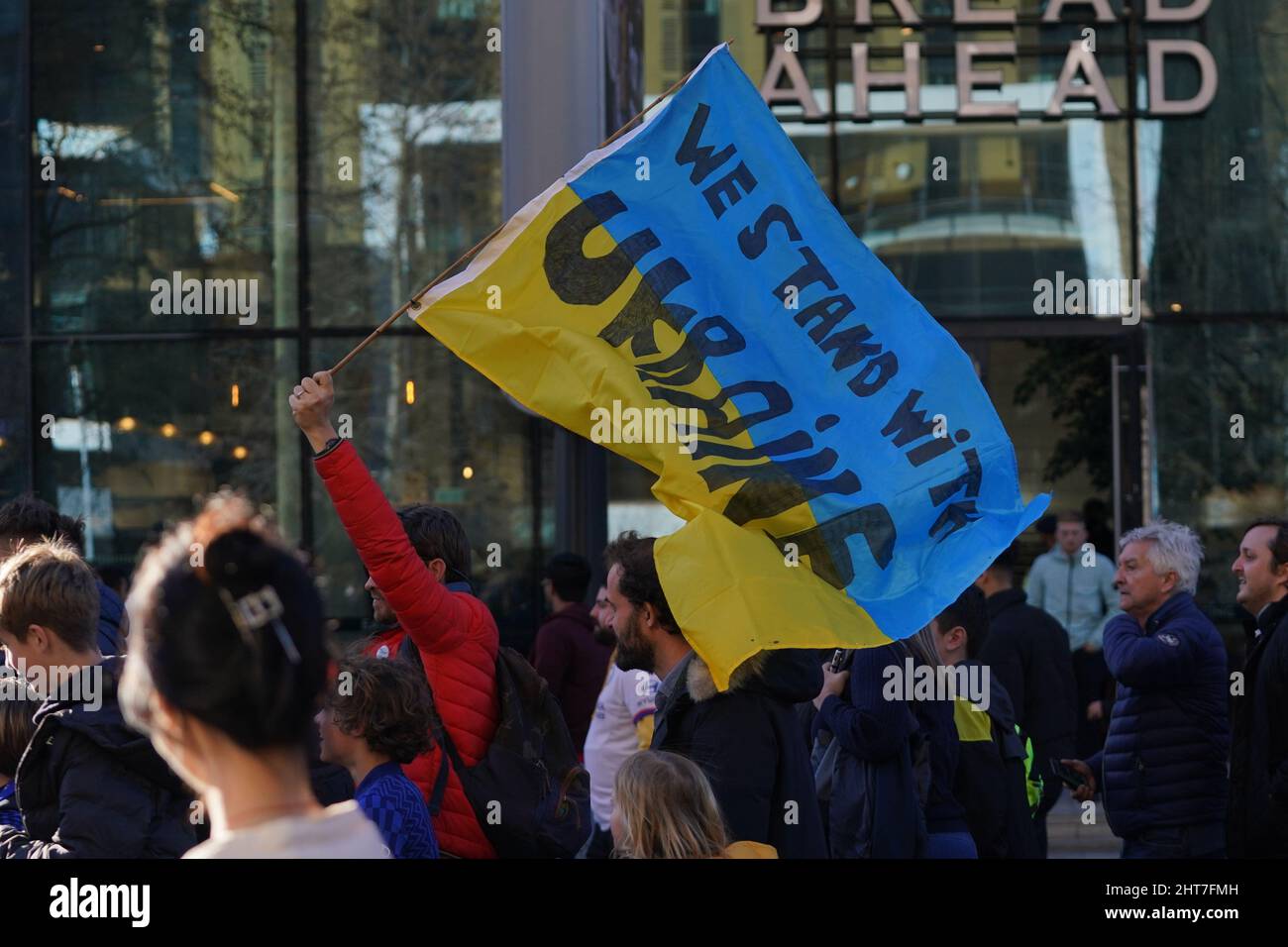 A fan waves a Ukrainian flag outside of the stadium ahead of the Carabao Cup Final between Chelsea FC and Liverpool FC at Wembley Stadium, London. Picture date: Sunday February 27, 2022. Stock Photo