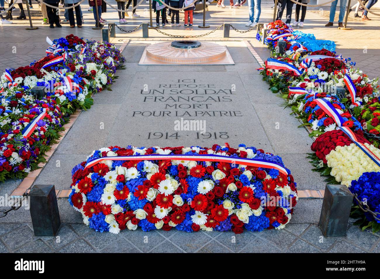 The Tomb of the Unknown Soldier, lying beneath the Arc de Triomphe in Paris, France, is adorned with funeral wreaths on the Armistice Day. Stock Photo