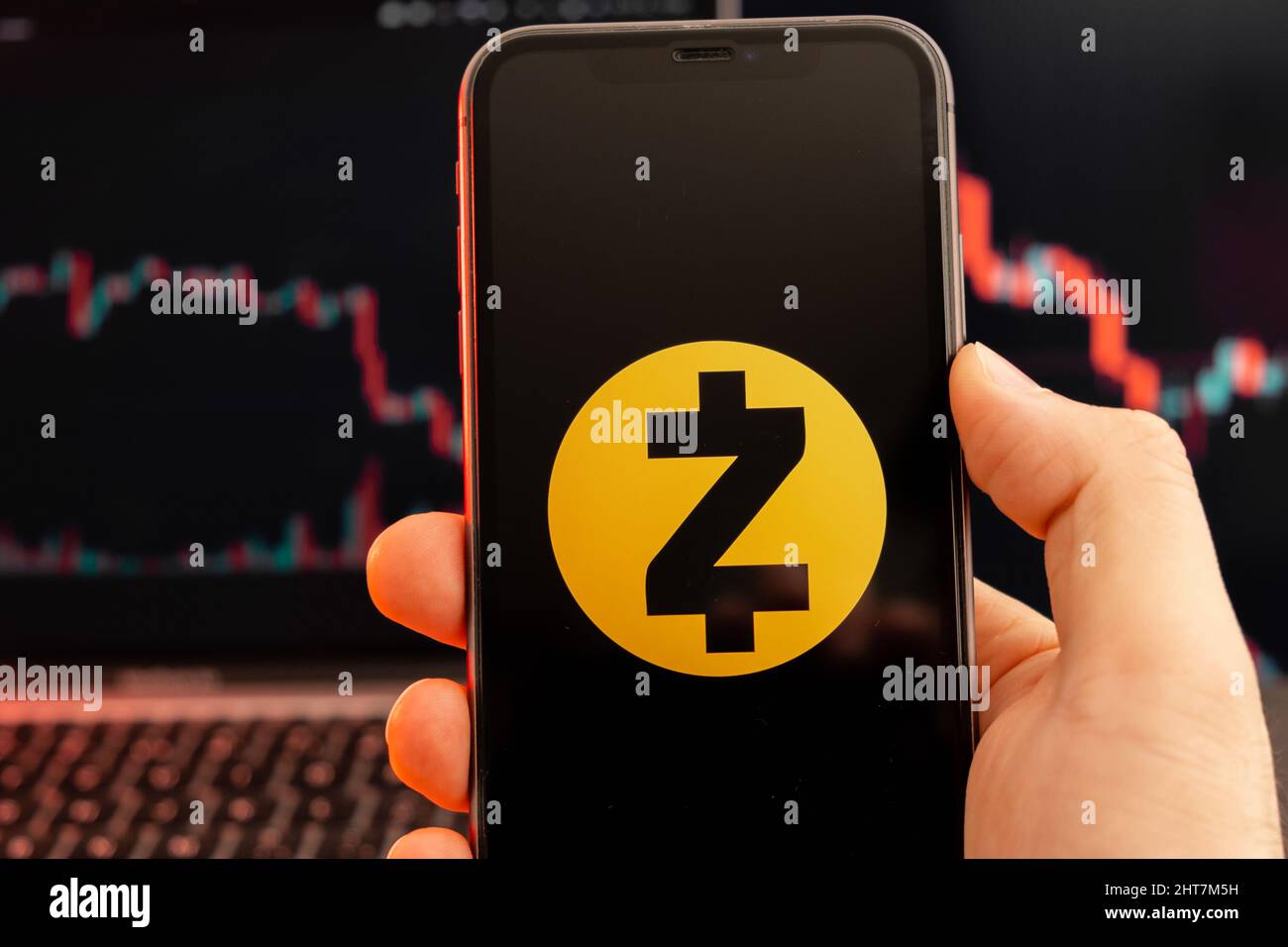 Zec Token Zcash ZEC cryptocurrency logo on the screen of smartphone in mans hand ...