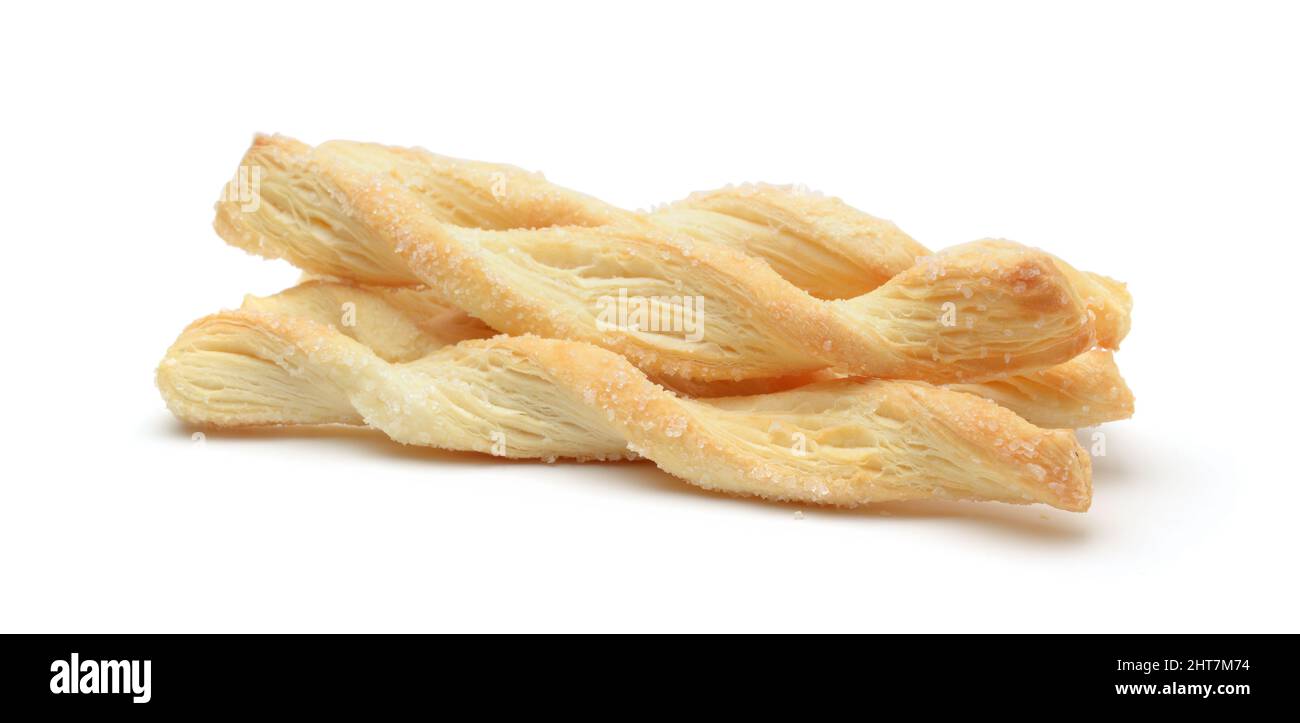 Group of puff pastry sticks with sugar isolated on white. Side view. Stock Photo