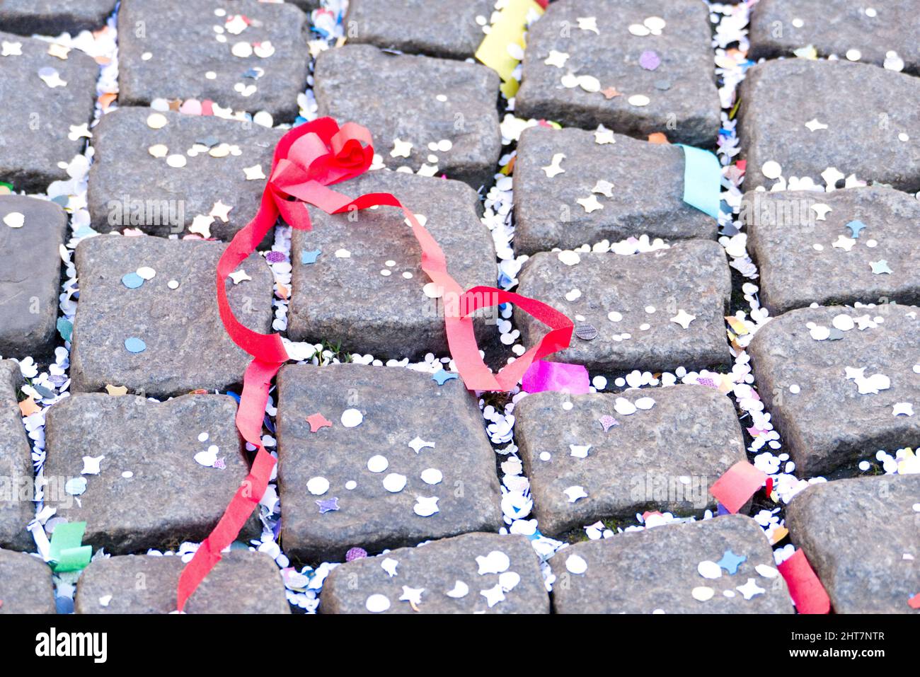 Maastricht, The Netherlands. 27th Feb 2022. The aftermath of the parade in Maastricht on Carnival Sunday. Confetti and streamers on the cobbled street. Anna Carpendale/Alamy Live News Stock Photo