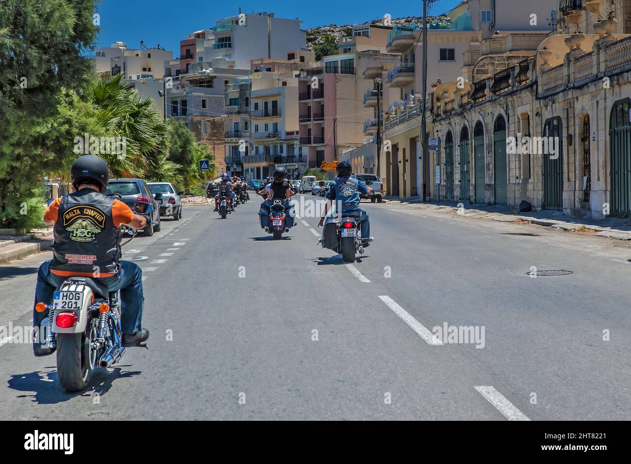 Motorcycle Riders ride down the road Stock Photo
