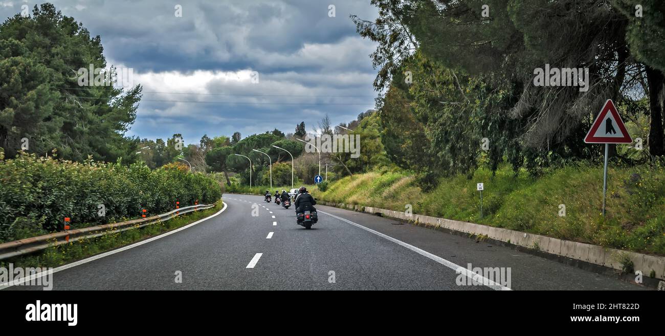 Motorcycle Riders Riding Down Road Motorcycle Riders ride down the road Stock Photo - Alamy