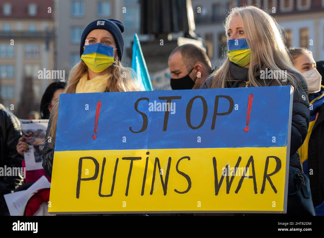 Dresden, Germany. 27th Feb, 2022. Participants hold a placard reading 'Stop Putin's War' at a demonstration on Neumarkt square against the Russian attack on Ukraine. According to police, more than 3000 people came together after a call by the parties in Dresden. Credit: Daniel Schäfer/dpa-Zentralbild/dpa/Alamy Live News Stock Photo