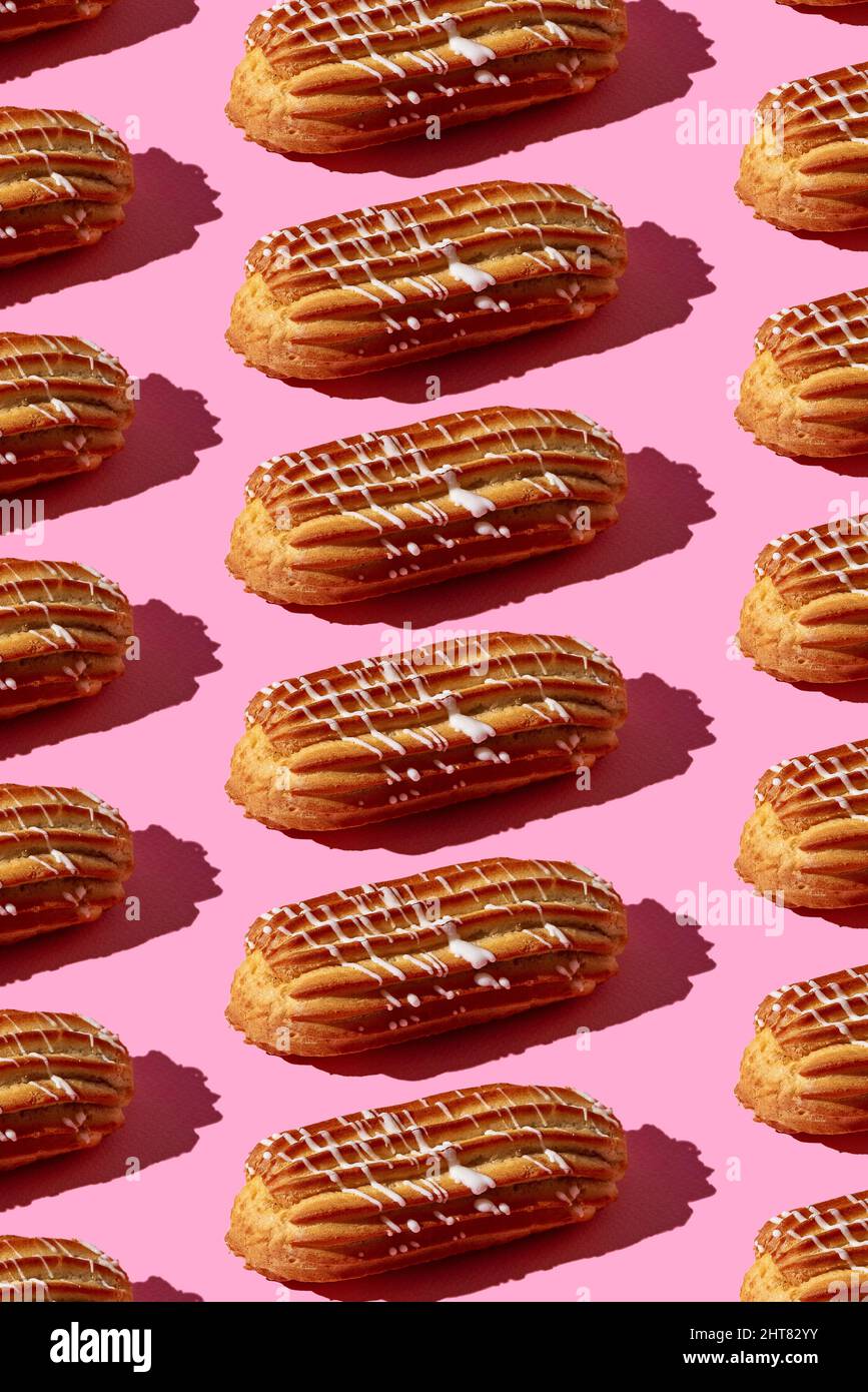 Pattern Eclair pattern of eclairs on a pink background Stock Photo - Alamy