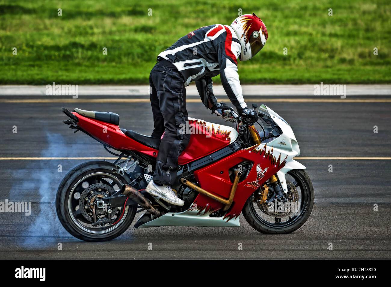 Stuntman Angyal Zoltan performs on his Motorbike Stock Photo