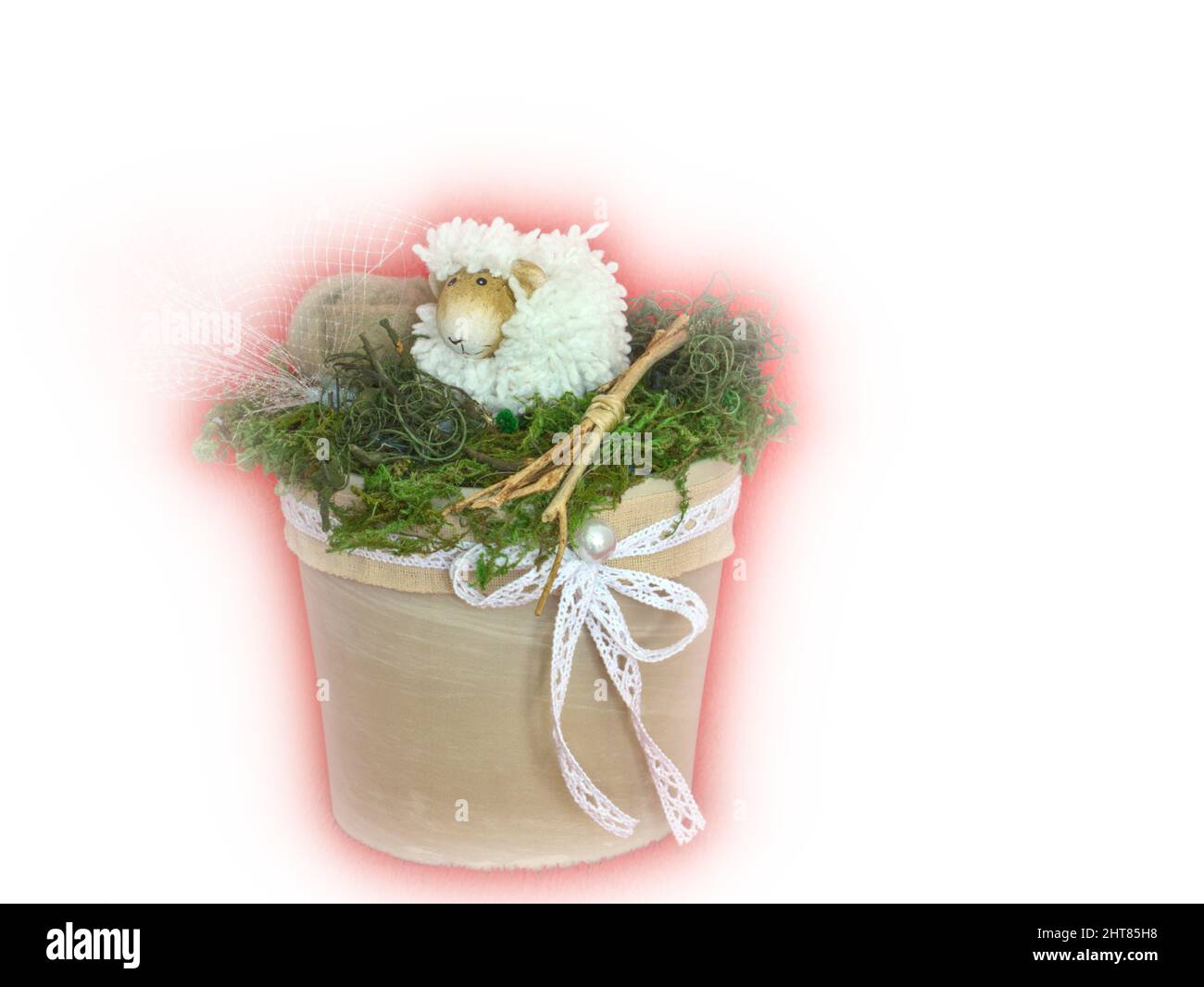 Handmade easter arrangement with sheep figure and moss in pot on white background Stock Photo