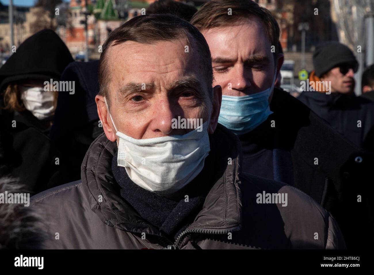 Moscow, Russia. 27th of February, 2022 Russian human rights activist Lev Ponomarev lays flowers at the site where late opposition leader Boris Nemtsov was fatally shot on a bridge near the Kremlin in central Moscow, on the seventh anniversary of his assassination Credit: Nikolay Vinokurov/Alamy Live News Stock Photo
