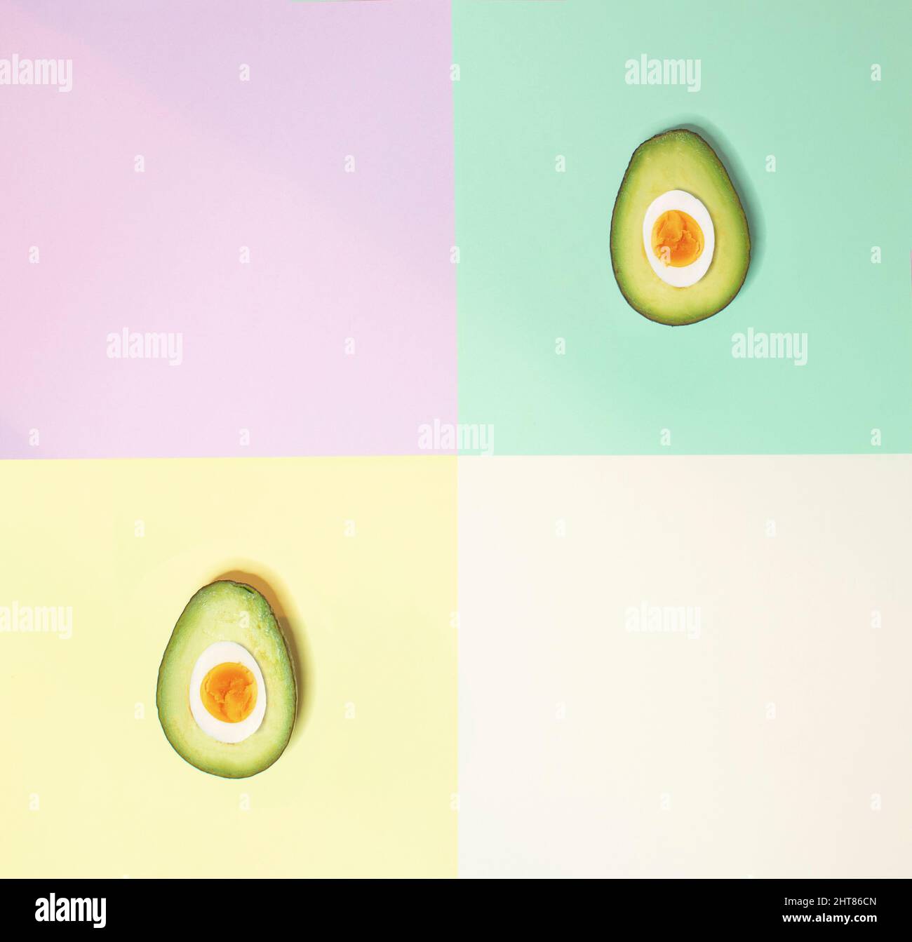 Avocado and egg on pastel colorful background. Creative flat lay. Stock Photo