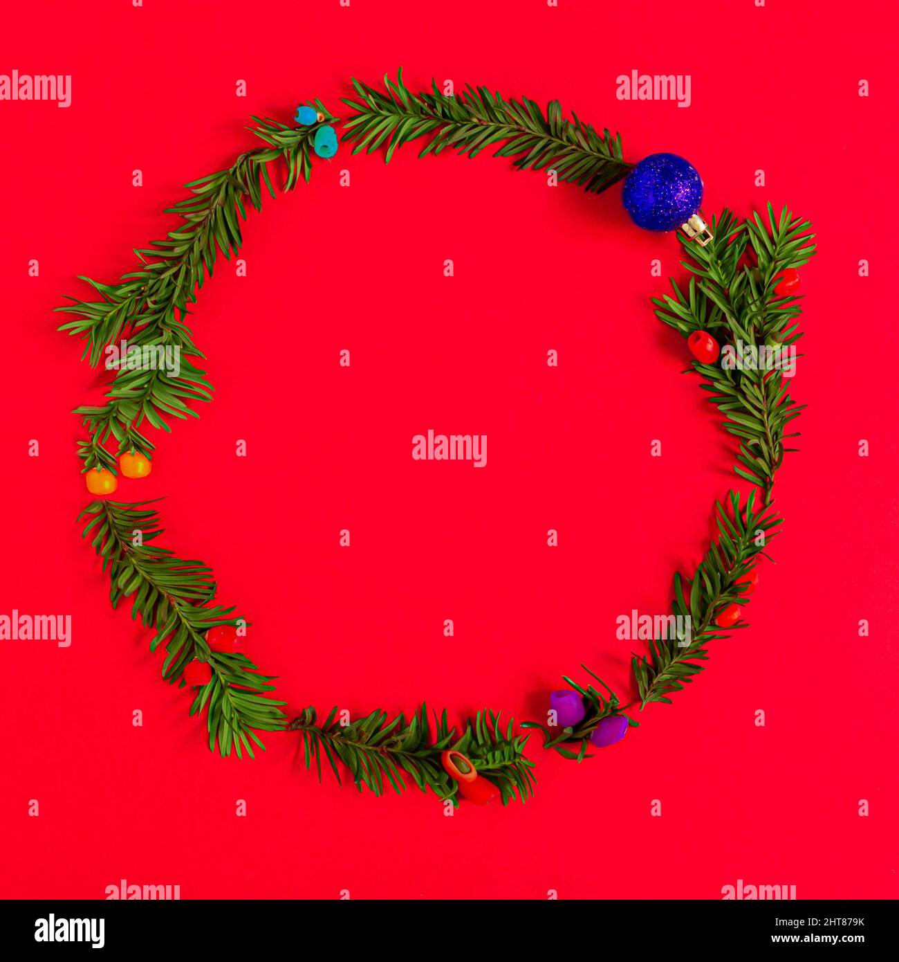Christmas wreath on a red background Stock Photo - Alamy