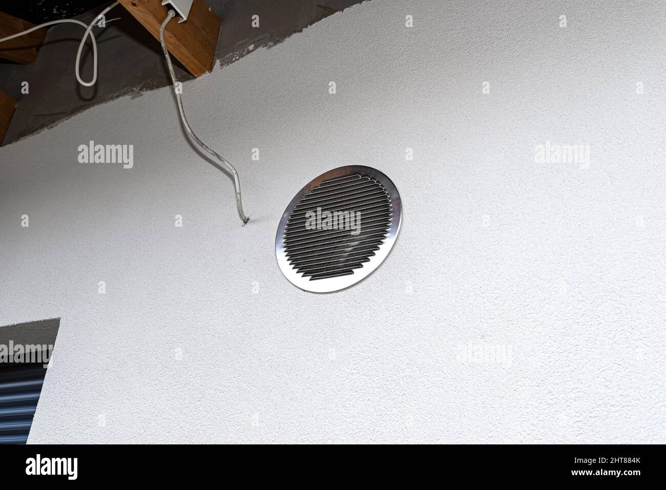 Air intake and exhaust in the wall of a single family house for