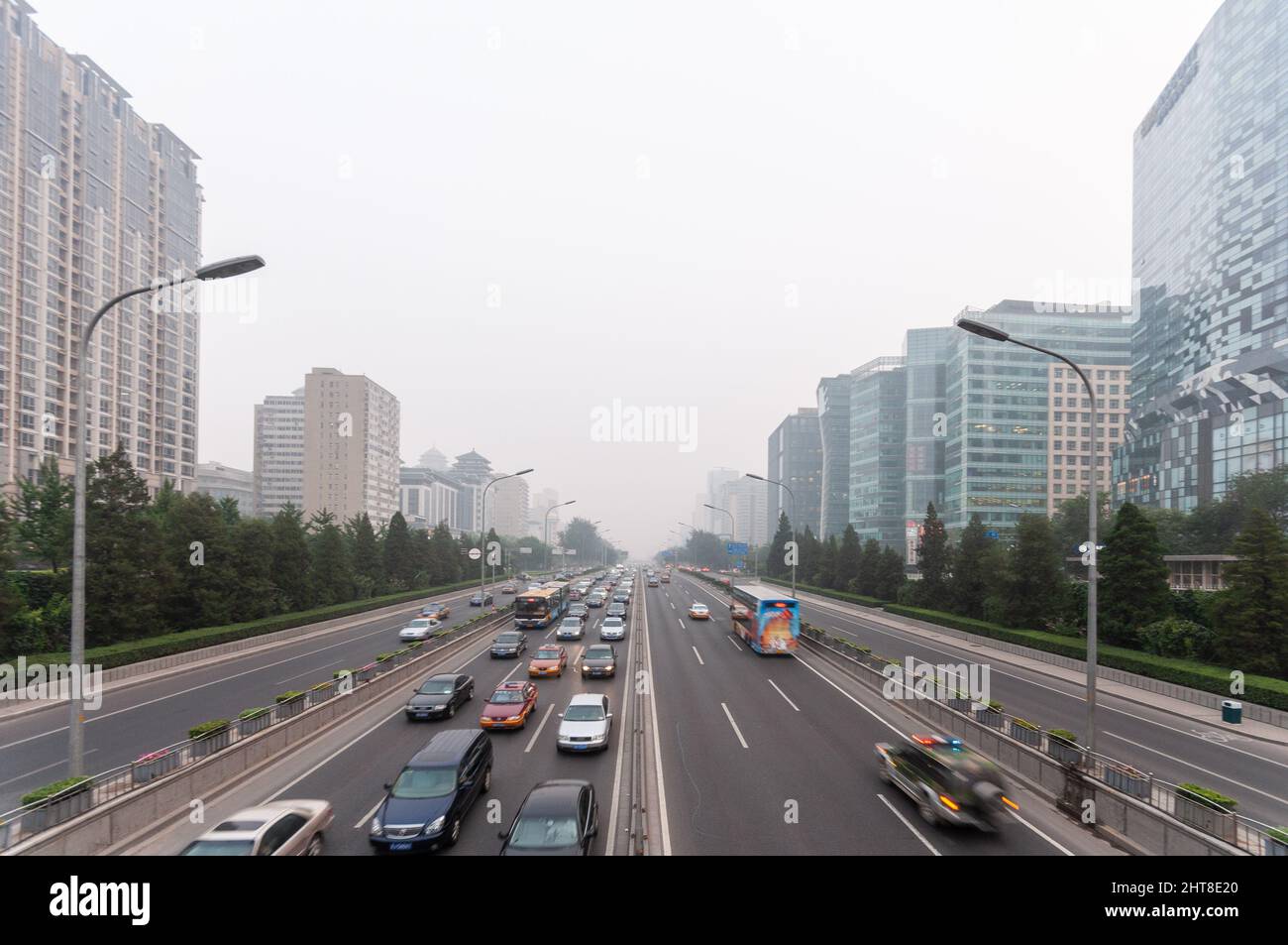 Beijing, China - August 9, 2010: Air pollution shrouds moden office buildings that line Beijing's Second Ring Road. Stock Photo