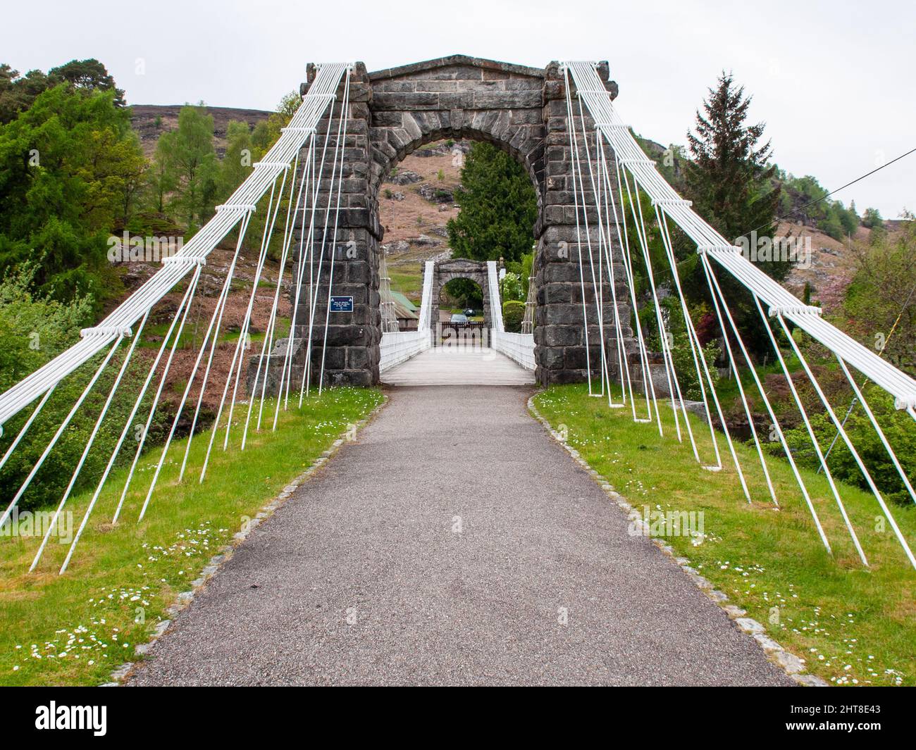 The old Bridge of Oich suspension bridge at Aberchalder in the Highlands of Scotland. Stock Photo