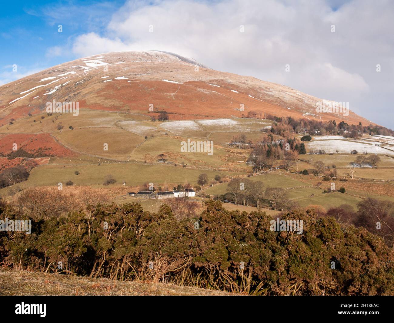 A dusting of snow lies on Blencathra mountain during winter in England's Lake District. Stock Photo