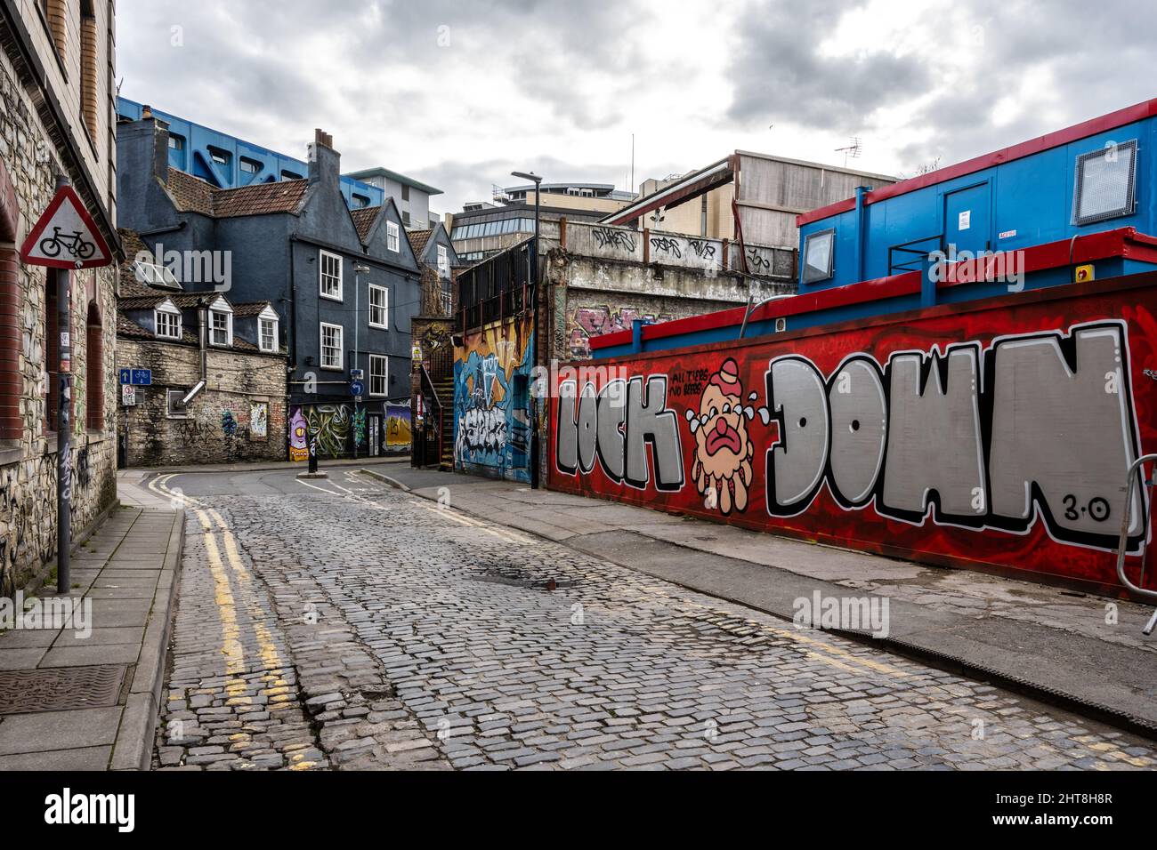 Graffiti covers old buildings and derelict sites on Moon Street in the Stokes Croft neighbourhood of Bristol. Stock Photo