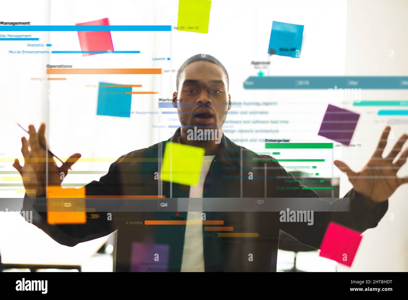 Stressed businessman due to overwork in office Stock Photo