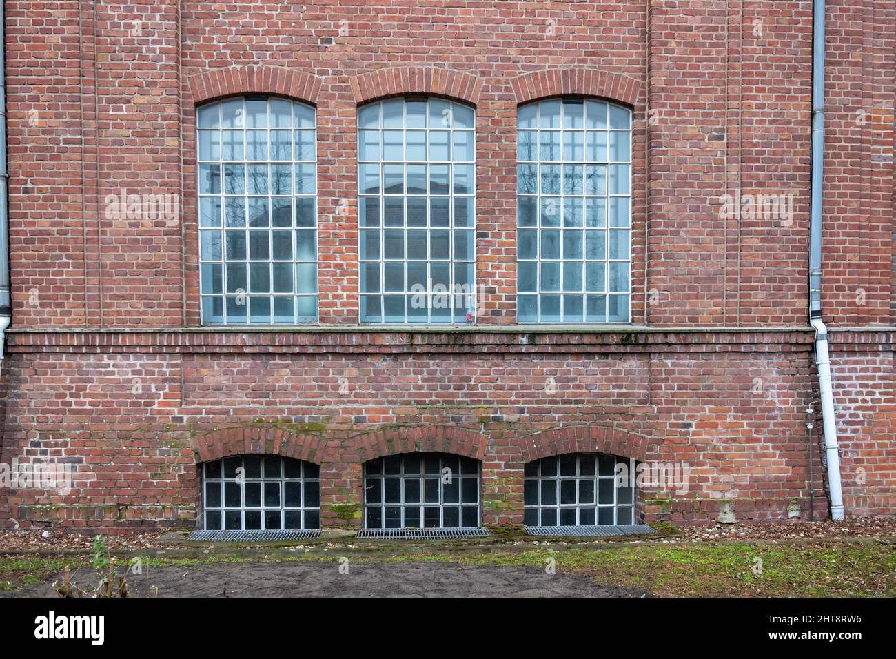 Brick building with glass windows outdoors Stock Photo - Alamy