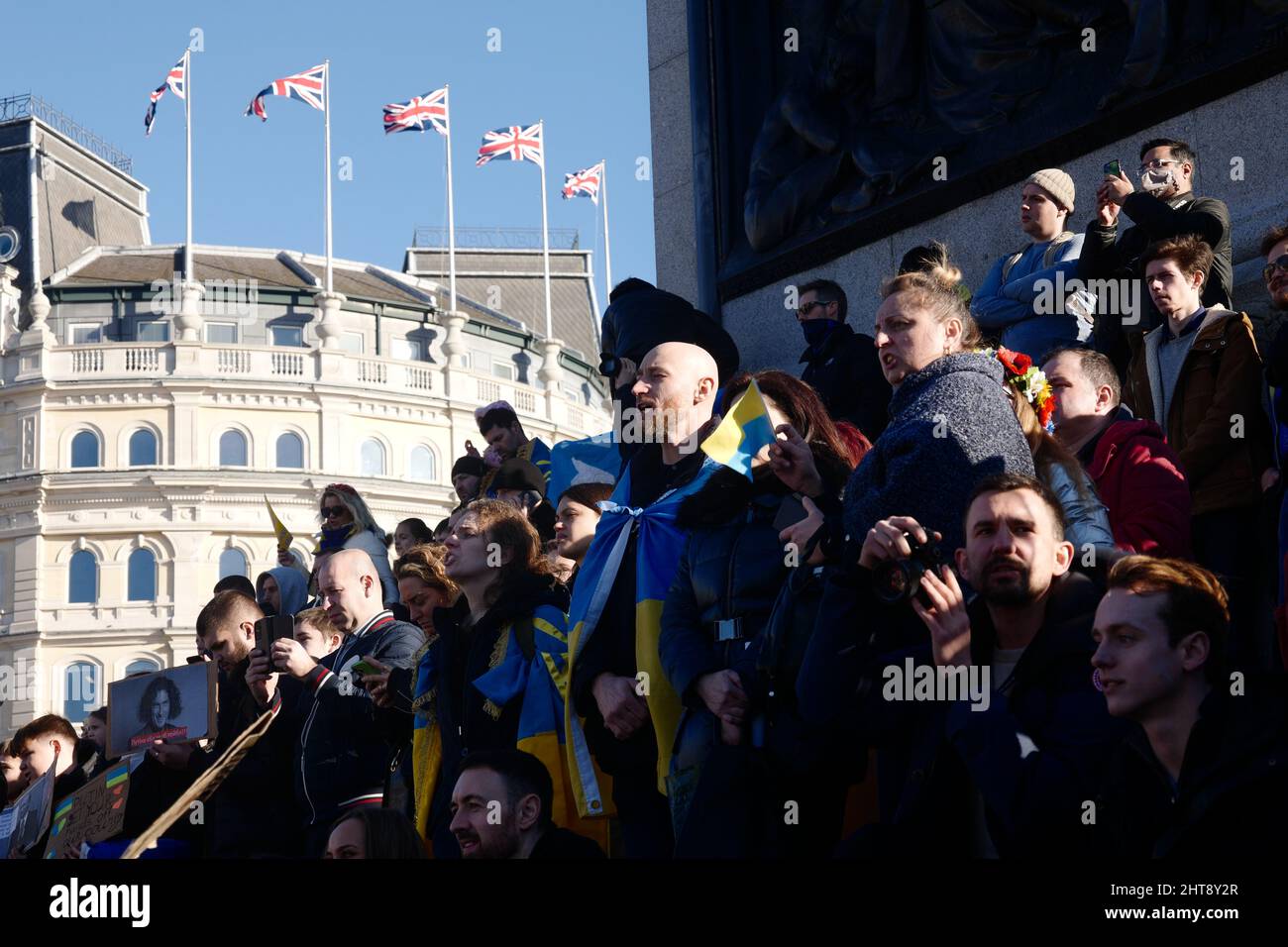 Crowd of protestors, base of Nelson's column, protest against Russia's invasion of Ukraine, Trafalgar Square, London, UK, 27 February 2022 Stock Photo