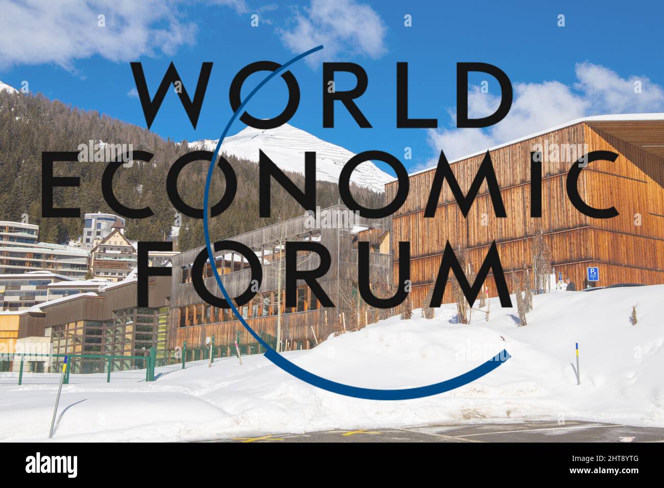 Logo of WEF (World Economic Forum), in the background the congress center of Davos Stock Photo