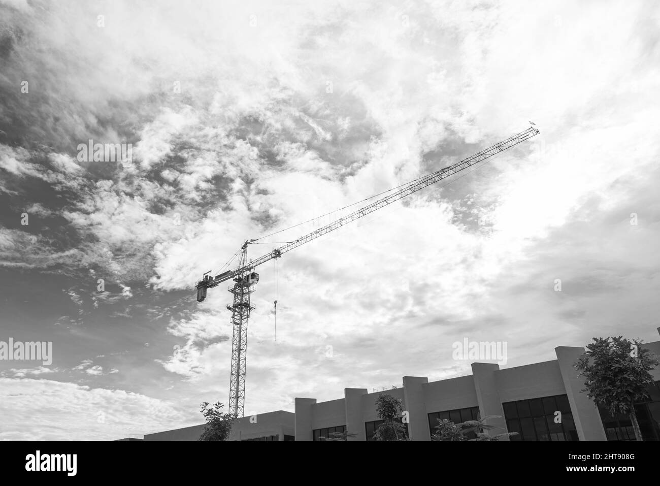 Low angle shot of an industrial crane under the sky Stock Photo