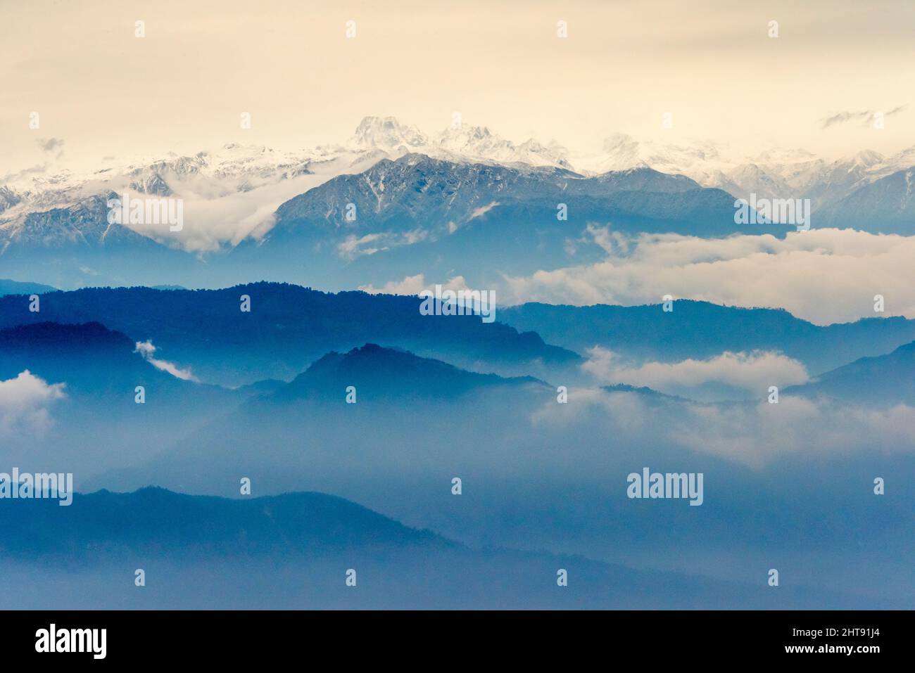 Landscape of the Himalayas in morning mist, Darjeeling District, West Bengal, India Stock Photo