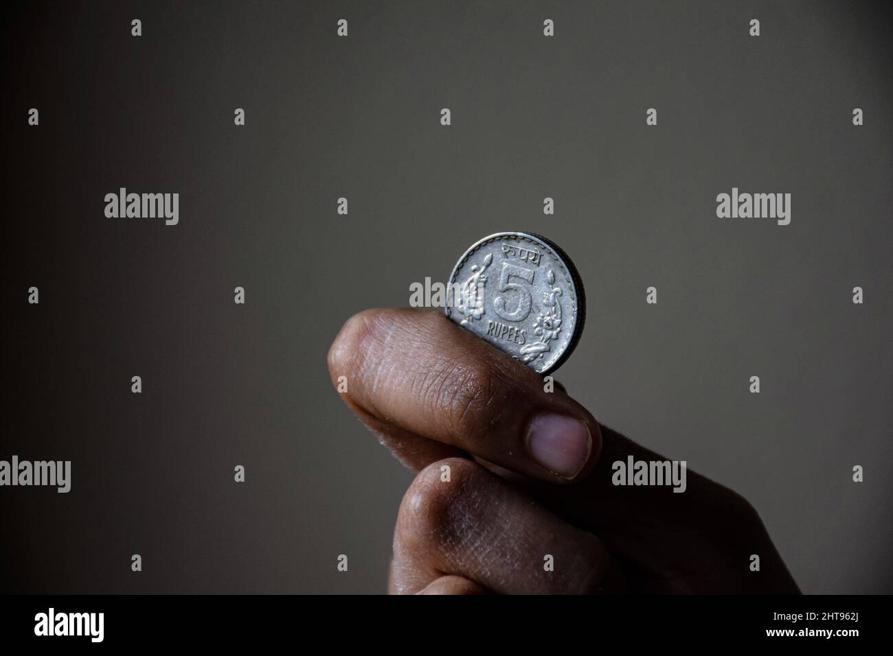A man holding five rupees coin Indian currency, Bangalore, Karnataka, India Stock Photo Alamy