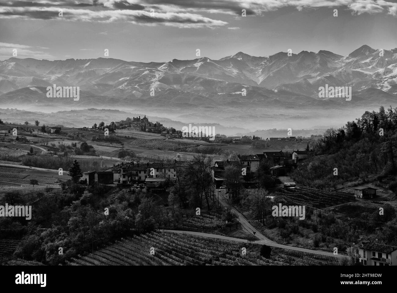 Aerial shot of a landscape under the cloudy skies in grayscale Stock ...