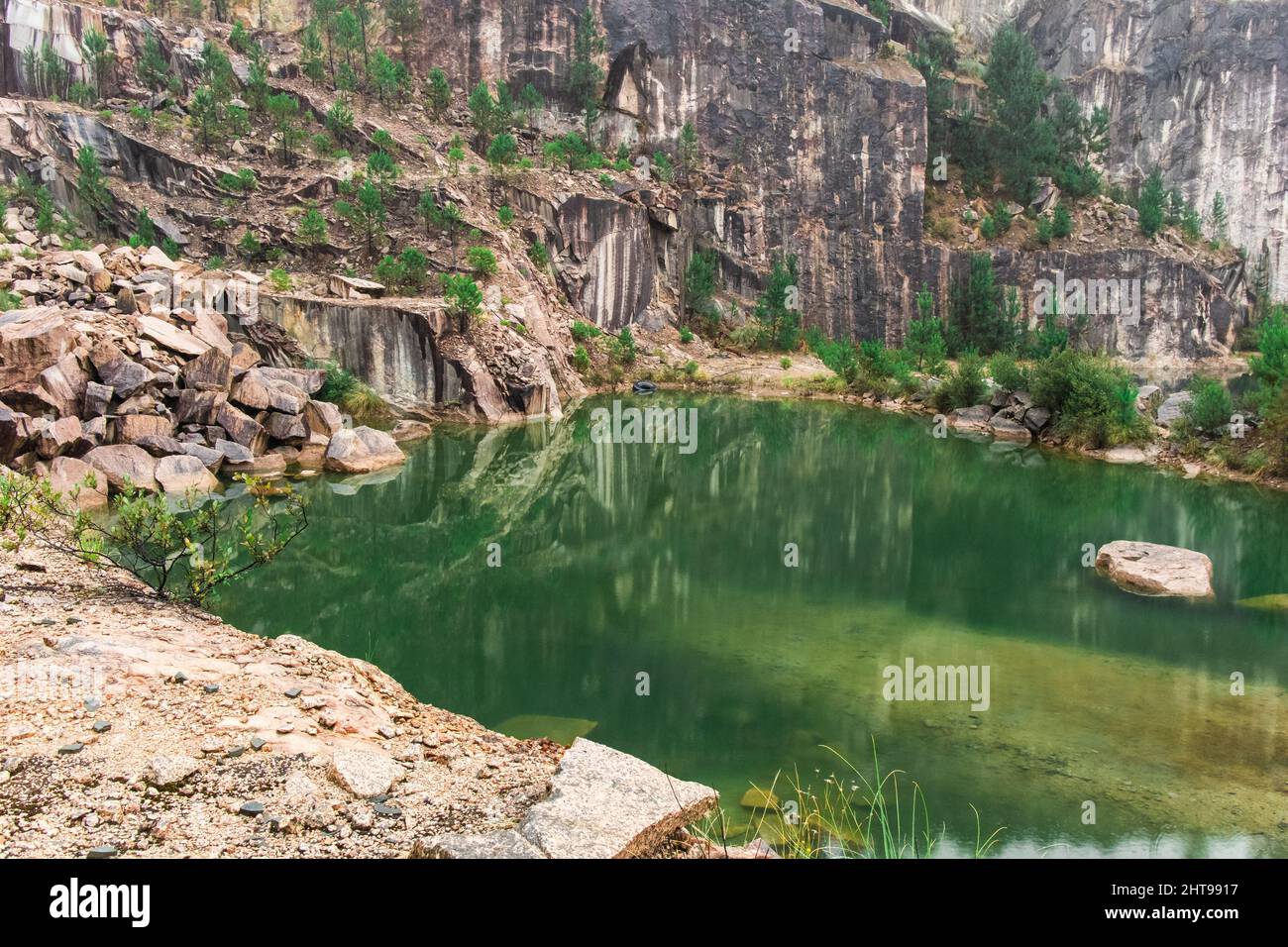 Surrounding Rocks Pond reflecting the surrounding rocks and plants Stock Photo - Alamy
