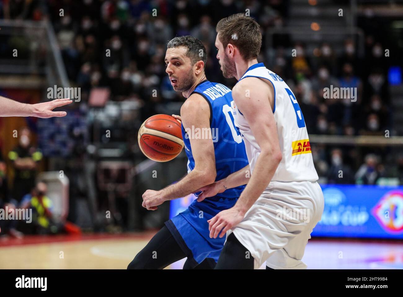 Bologna, Italy. 27th Feb, 2022. Amedeo Della Valle (ITALY) and Jon Axel Gudmundsson (ICELAND) in action during FIBA World Cup Qualifiers - Italy vs Iceland, Iternational Basketball Teams in Bologna, Italy, February 27 2022 Credit: Independent Photo Agency/Alamy Live News Stock Photo