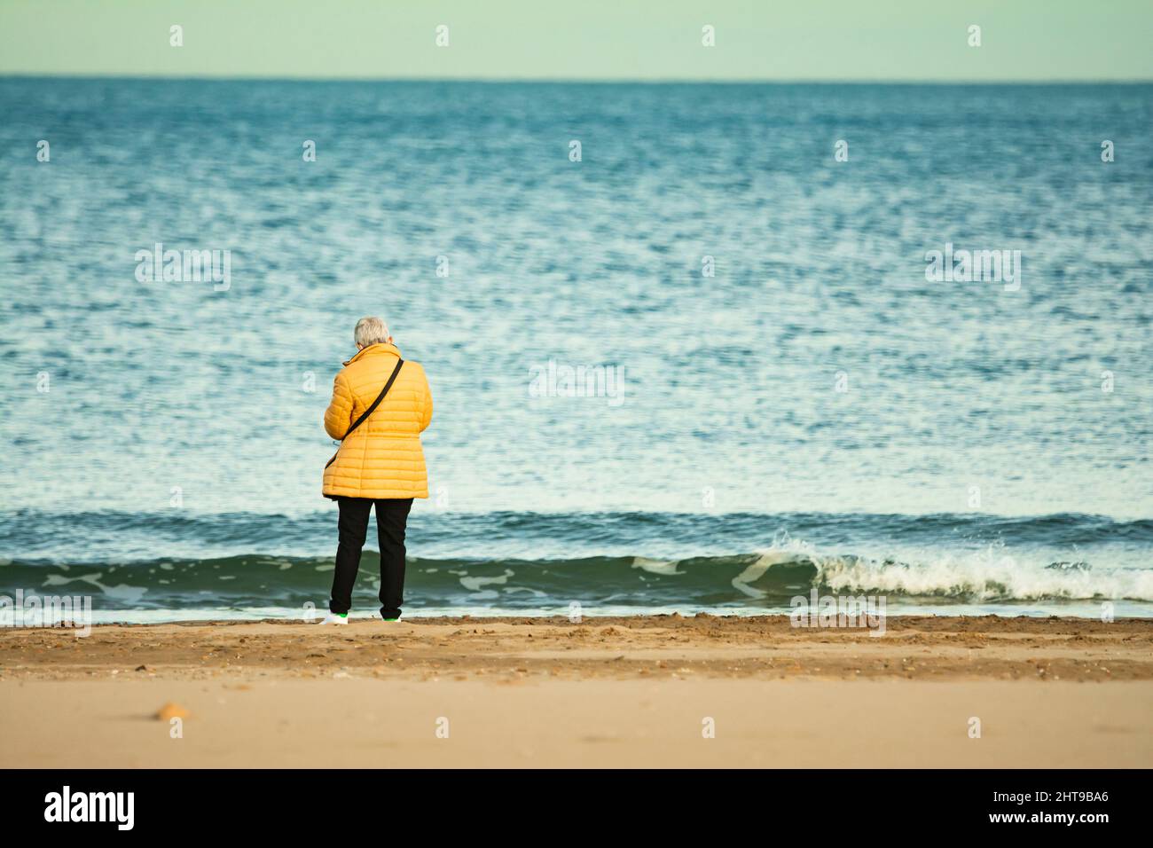 Rear view old woman at the beach Stock Photo - Alamy