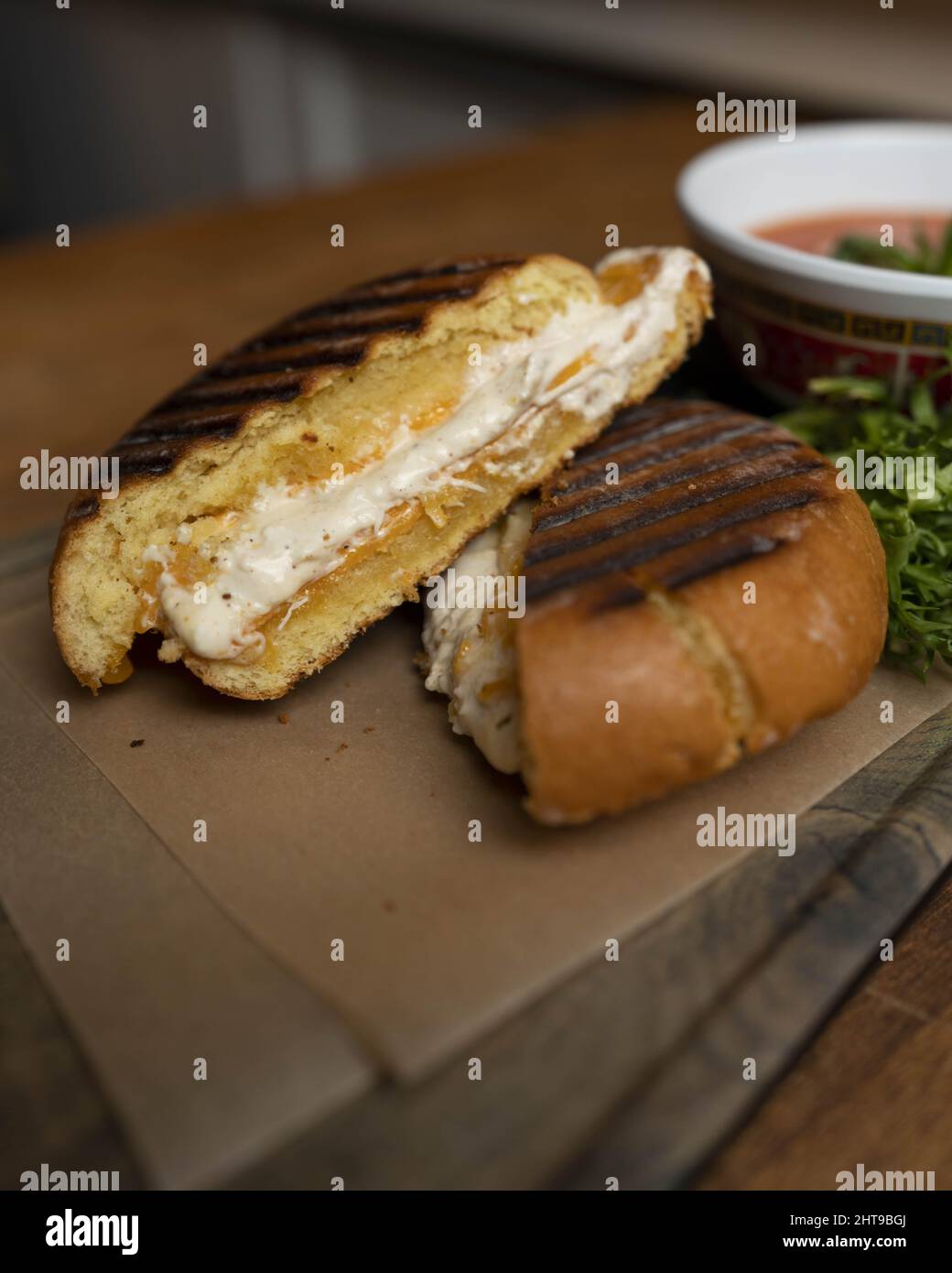 Closeup shot of a panino on a wooden board Stock Photo