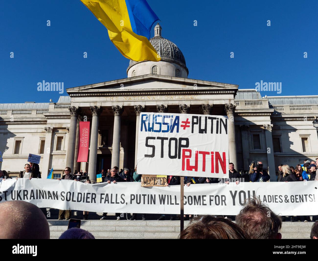 View of anti-Putin and anti-Russian banners in front of the National Gallery in Trafalgar Square London to protest at the Russian invasion of Ukraine Stock Photo