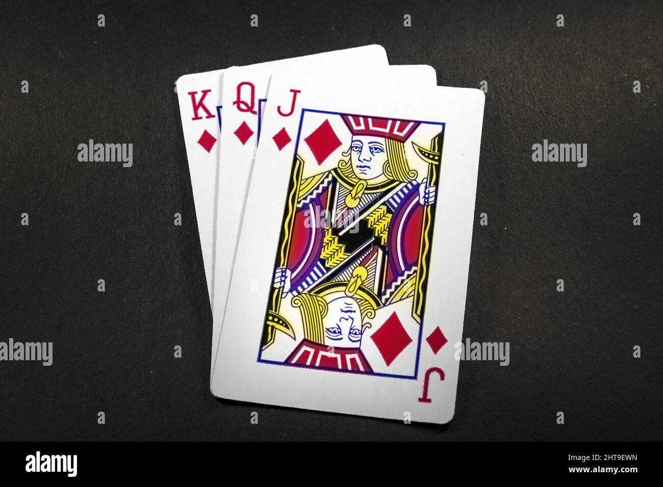 Playing cards isolated on black background Stock Photo - Alamy