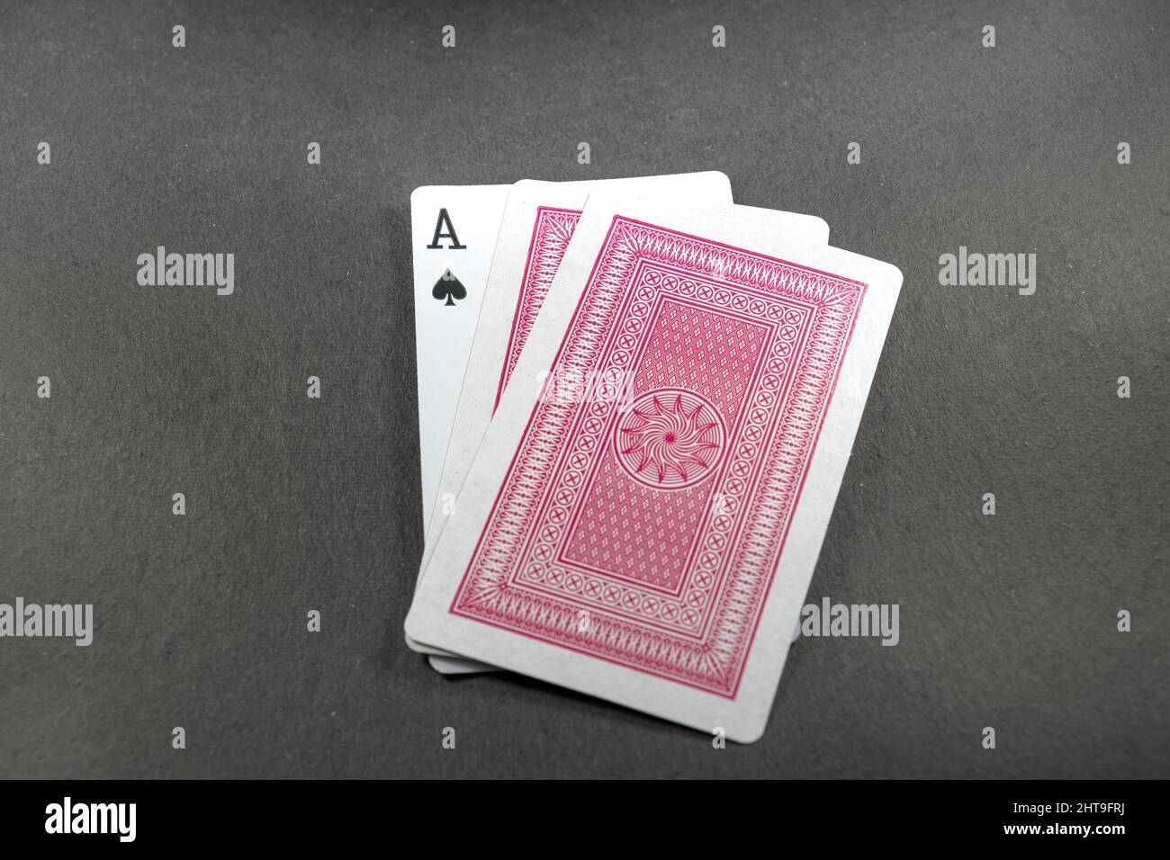 Playing cards isolated on black background Stock Photo - Alamy